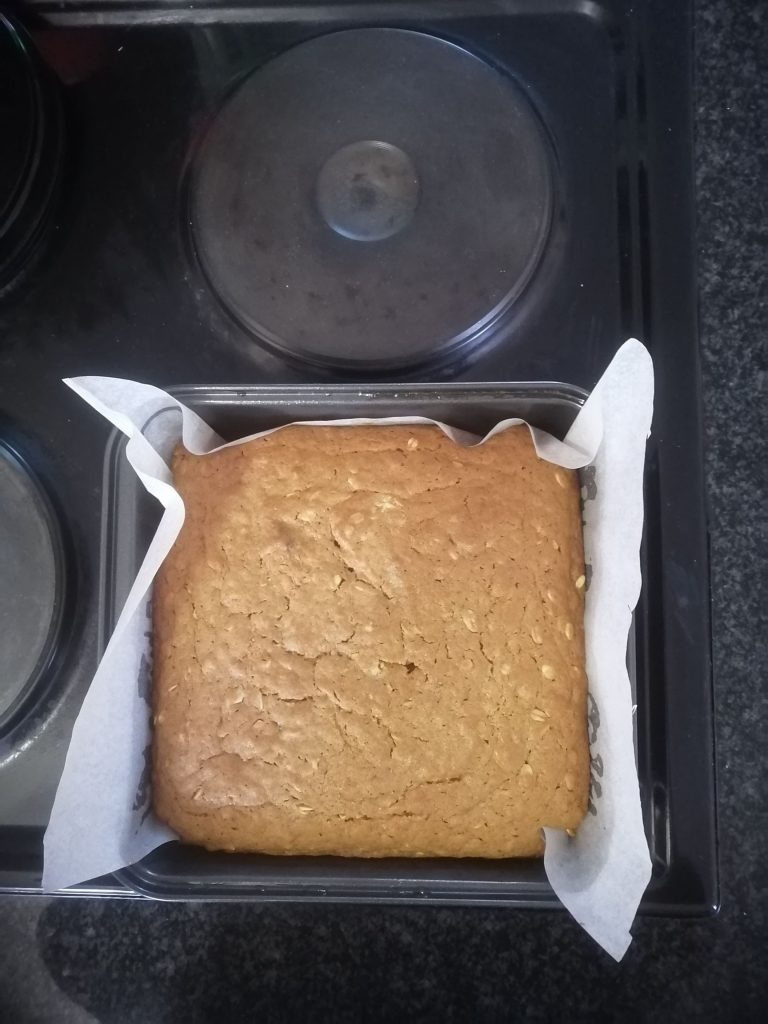 parkin in cake tin on stovetop